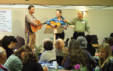 SING ALONG: Ryan Barfoot and Karin Westland lead the Chamber of Commoners in a sing-along of In a Town This Size. (Photo by Giovanni Spezzacatena)